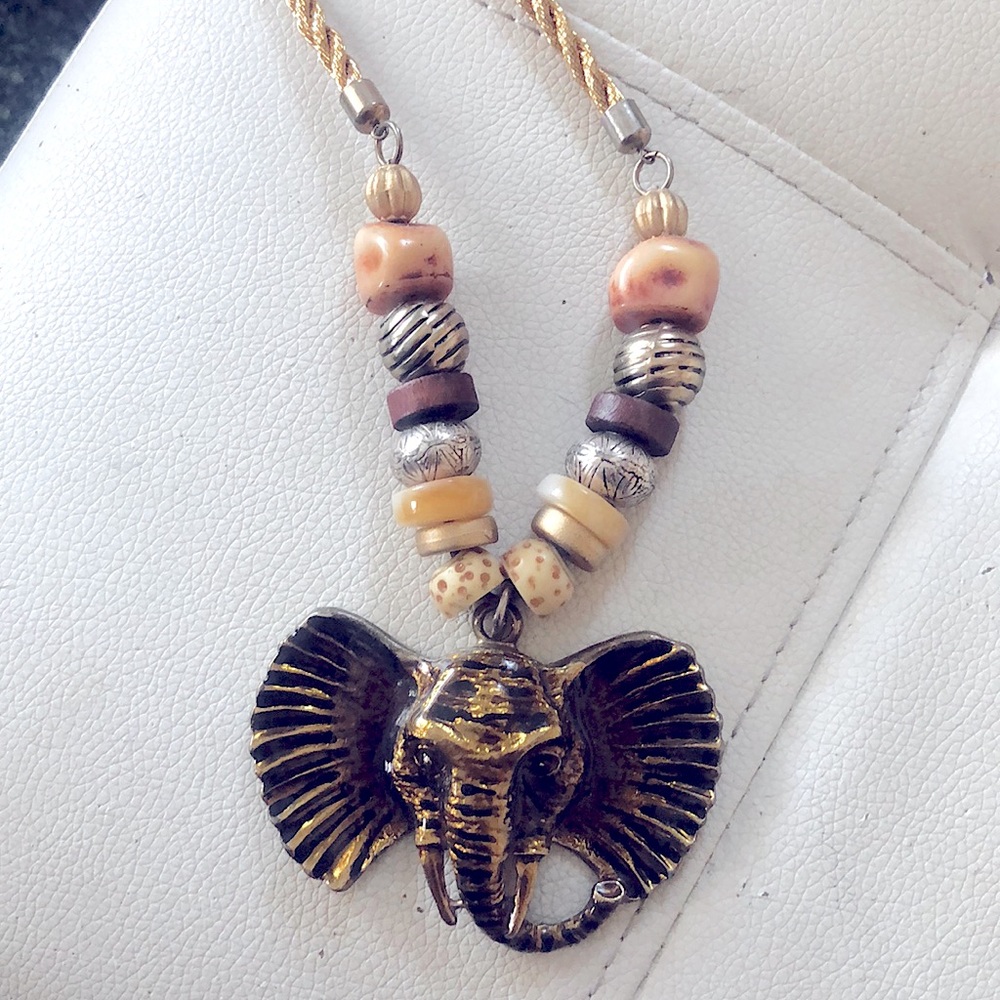 Vintage gold elephant necklace with neutral beads